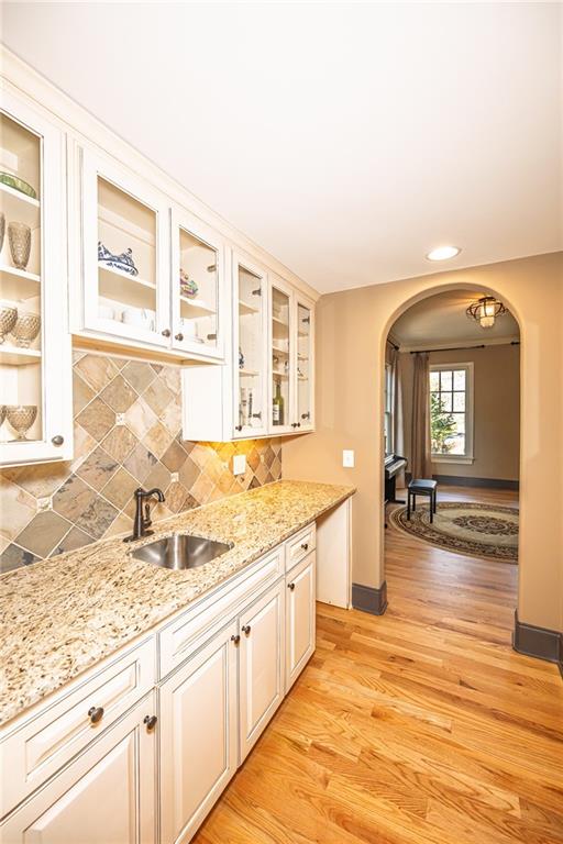 1103 Ridenour Court Northwest Kennesaw, GA 30152 - Photo 16 of 56 a bathroom with a granite countertop sink and a window