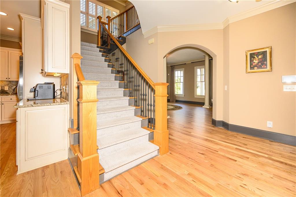 1103 Ridenour Court Northwest Kennesaw, GA 30152 - Photo 18 of 56 a view of entryway and hall with wooden floor