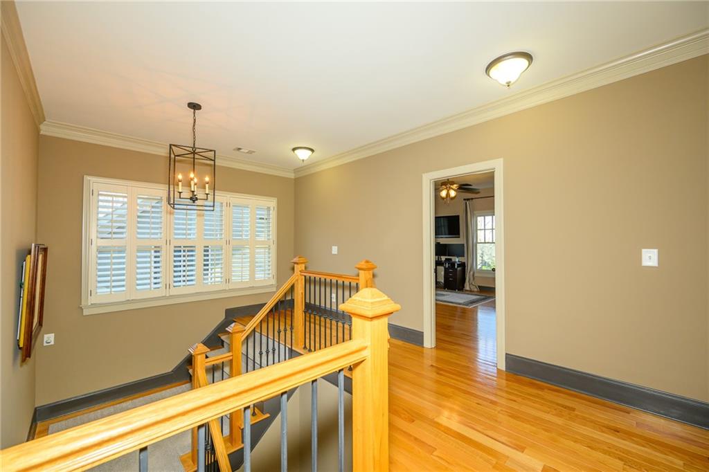 1103 Ridenour Court Northwest Kennesaw, GA 30152 - Photo 19 of 56 a view of a livingroom with furniture hardwood floor and staircase