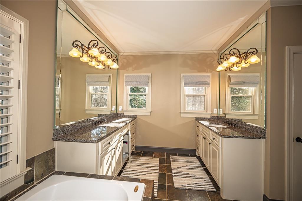1103 Ridenour Court Northwest Kennesaw, GA 30152 - Photo 29 of 56 a kitchen that has a sink and a stove