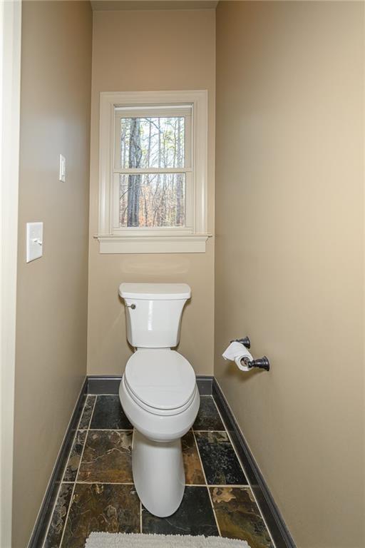 1103 Ridenour Court Northwest Kennesaw, GA 30152 - Photo 31 of 56 a bathroom with a toilet and a window