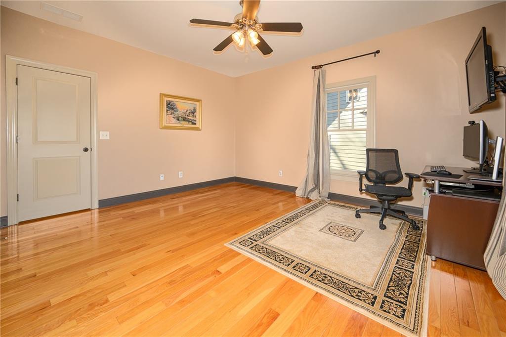 1103 Ridenour Court Northwest Kennesaw, GA 30152 - Photo 35 of 56 a workspace with furniture and a flat screen tv