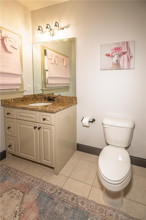 1103 Ridenour Court Northwest Kennesaw, GA 30152 - Photo 39 of 56 a bathroom with a toilet sink and mirror