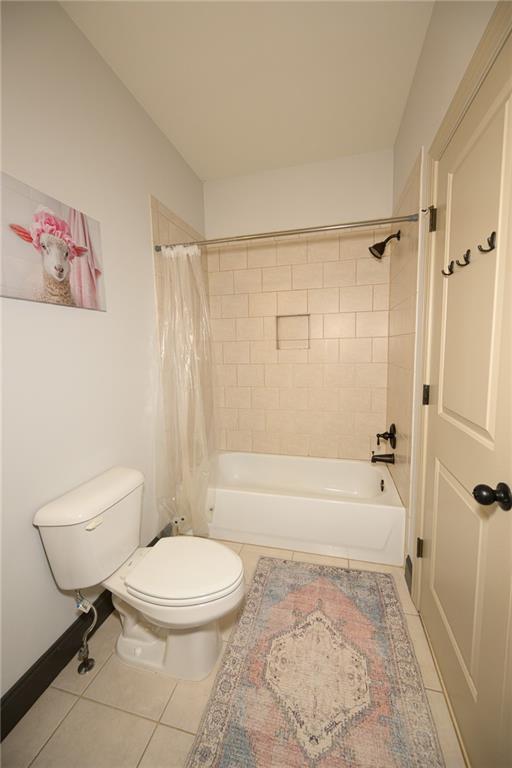 1103 Ridenour Court Northwest Kennesaw, GA 30152 - Photo 40 of 56 a bathroom with a toilet a sink and bathtub