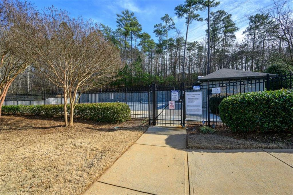 1103 Ridenour Court Northwest Kennesaw, GA 30152 - Photo 46 of 56 a view of a house with a yard