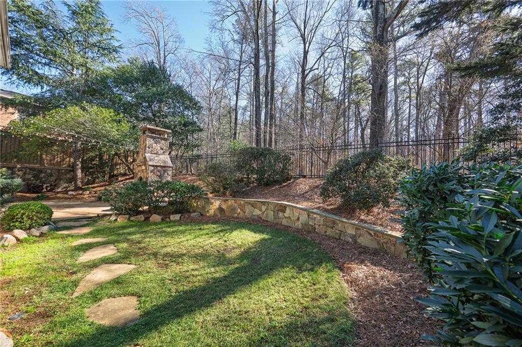 1103 Ridenour Court Northwest Kennesaw, GA 30152 - Photo 49 of 56 a view of a garden with a bench