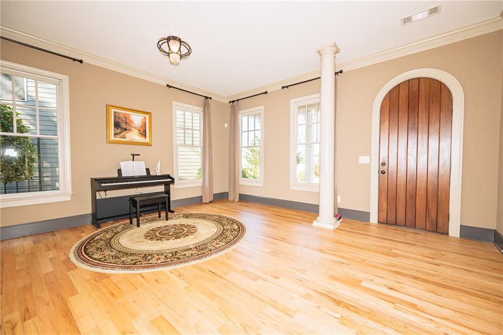 1103 Ridenour Court Northwest Kennesaw, GA 30152 - Photo 5 of 56 a view of a livingroom with wooden floor and a window