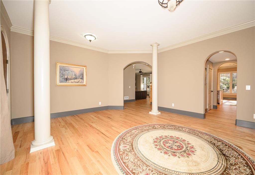 1103 Ridenour Court Northwest Kennesaw, GA 30152 - Photo 6 of 56 a view of a bedroom with wooden floor and a rug