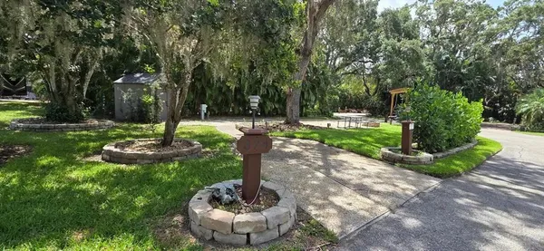 a view of a garden with a fountain