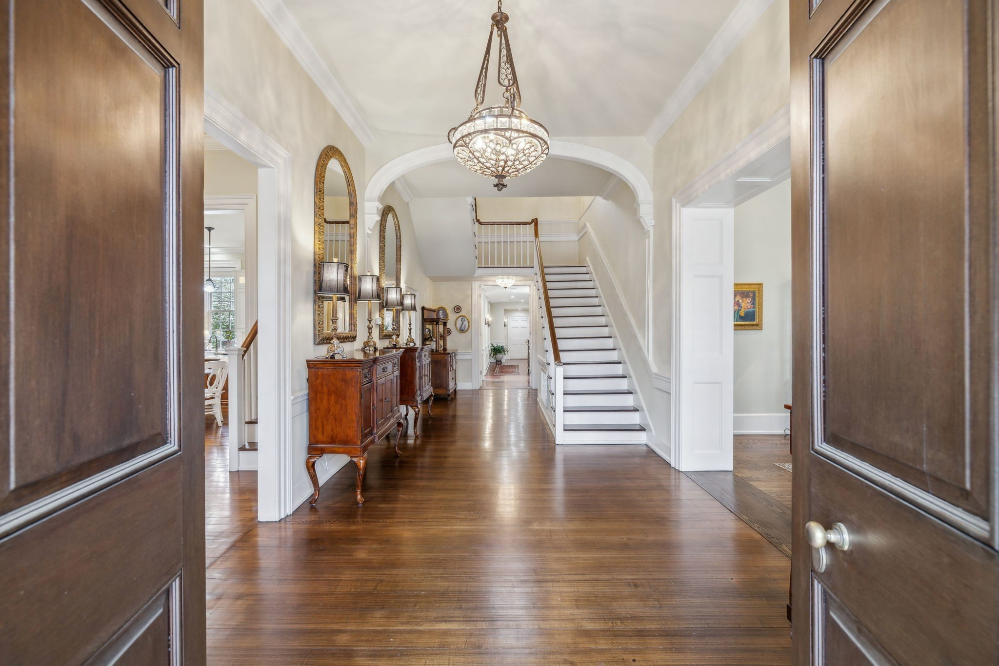 224 3rd Avenue South Franklin, TN 37064 - Photo 13 of 92 a view of a hallway with wooden floor and stairs
