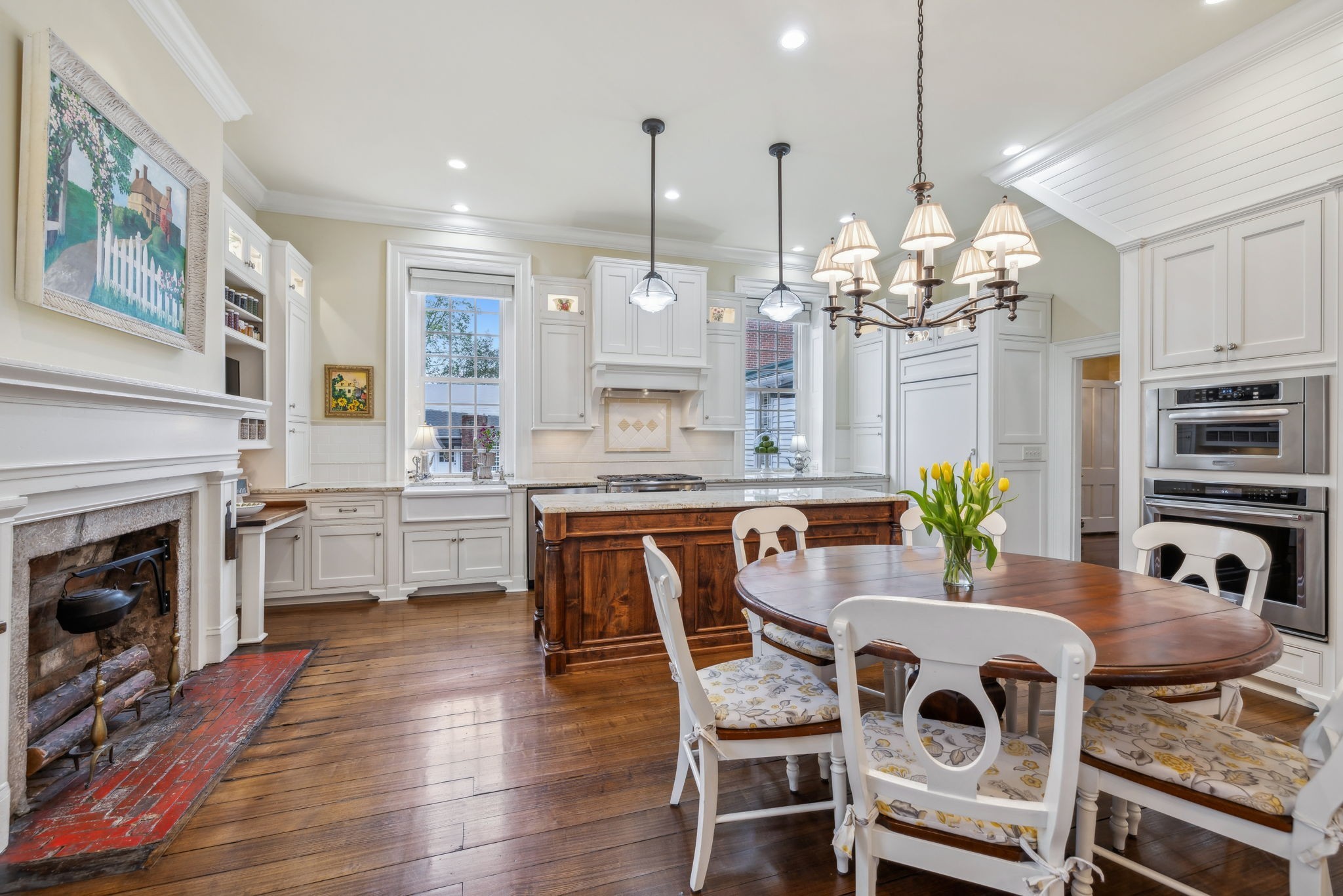 224 3rd Avenue South Franklin, TN 37064 - Photo 33 of 92 a dining room with furniture a chandelier and kitchen view
