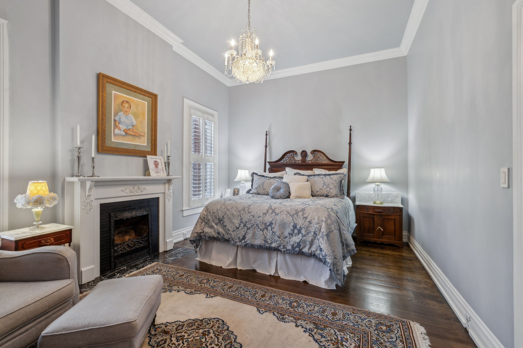 224 3rd Avenue South Franklin, TN 37064 - Photo 44 of 92 a bedroom with a bed and a fireplace