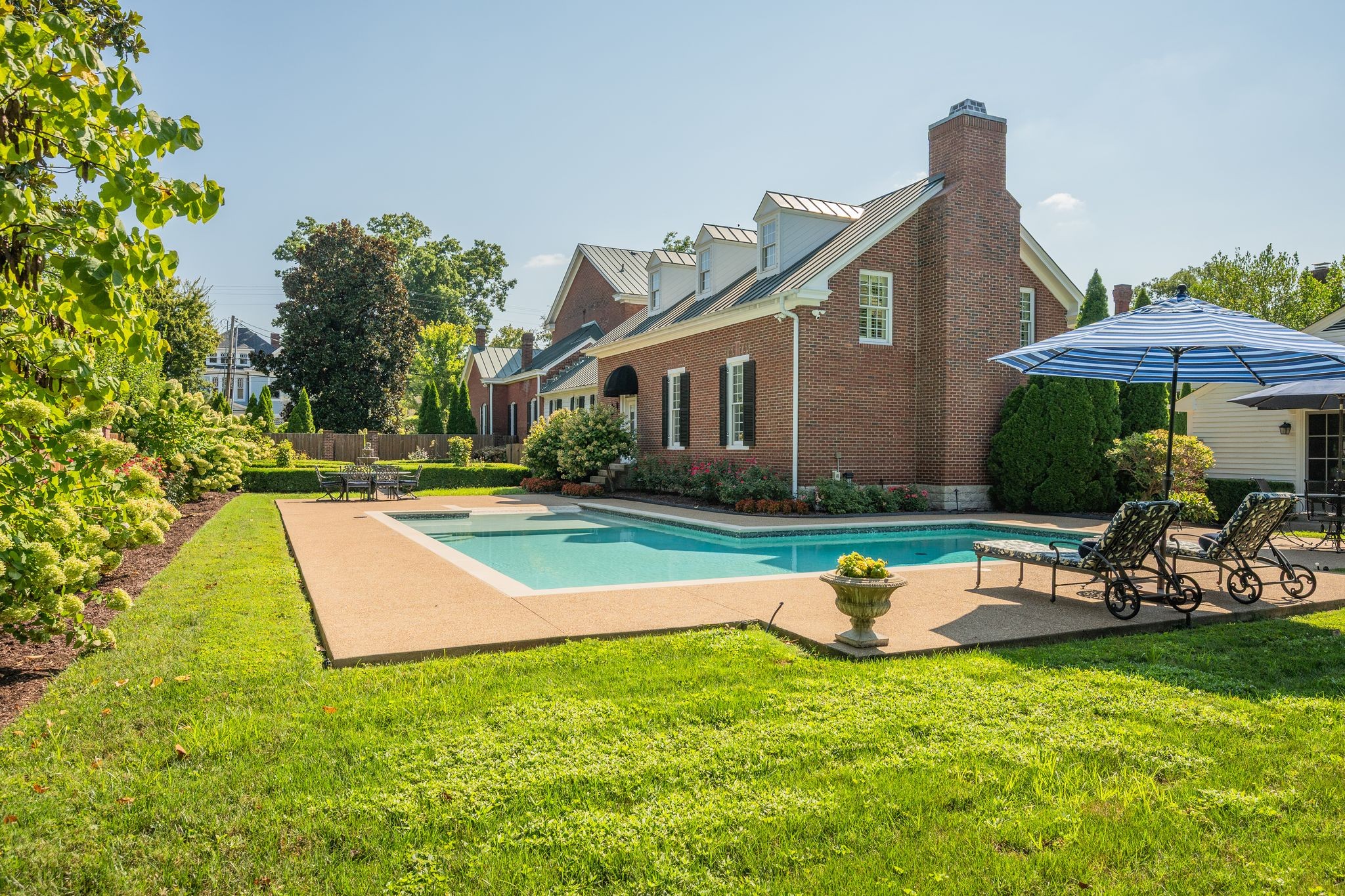 224 3rd Avenue South Franklin, TN 37064 - Photo 5 of 92 a view of a house with backyard sitting area and swimming pool