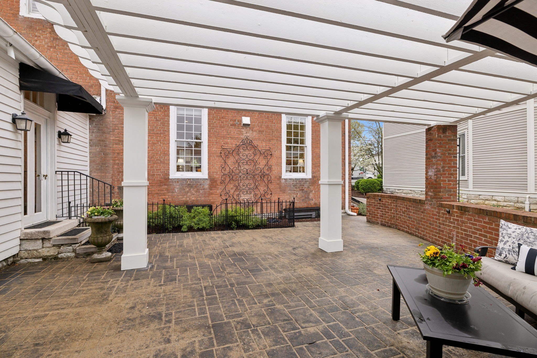 224 3rd Avenue South Franklin, TN 37064 - Photo 67 of 92 a view of a patio with chairs and a potted plant