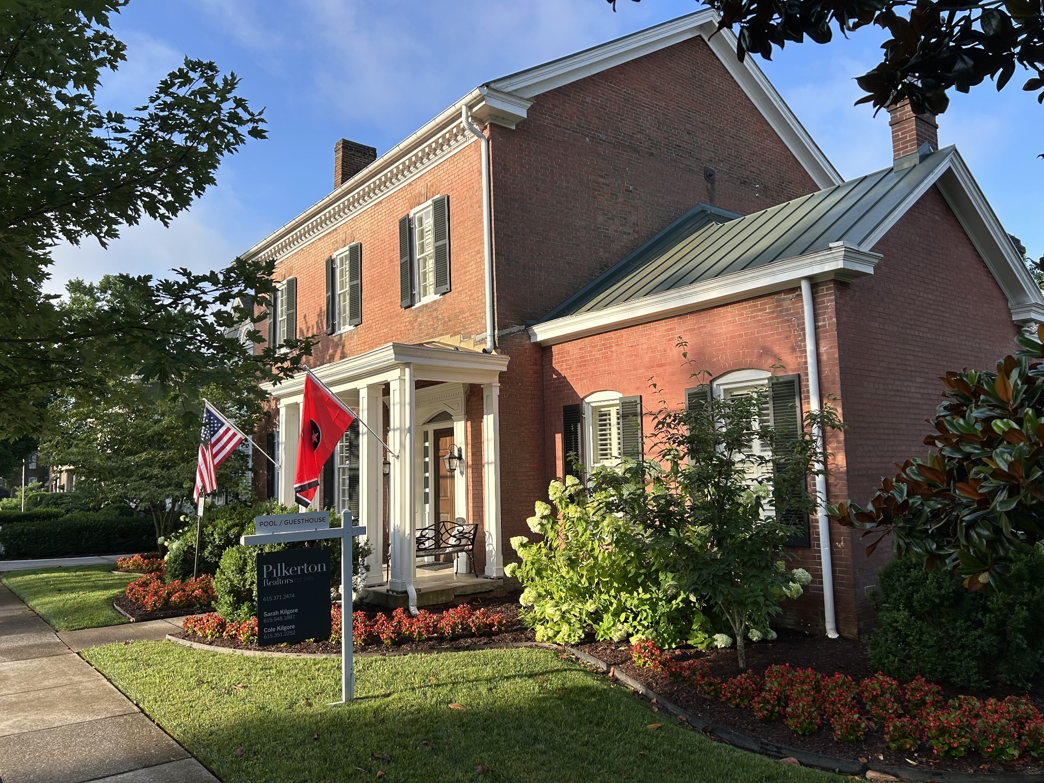 224 3rd Avenue South Franklin, TN 37064 - Photo 85 of 92 a front view of a house with a yard and potted plants