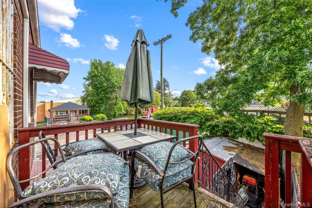 a view of a roof deck with furniture