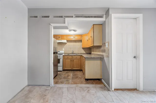 a utility room with a sink dryer and washer