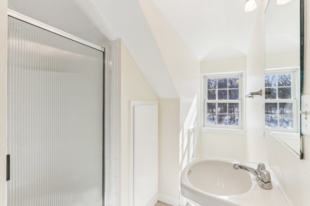 27 Elm Road, Unit D Devens, MA 01434 - Photo 18 of 31 a bathroom with a sink and a mirror
