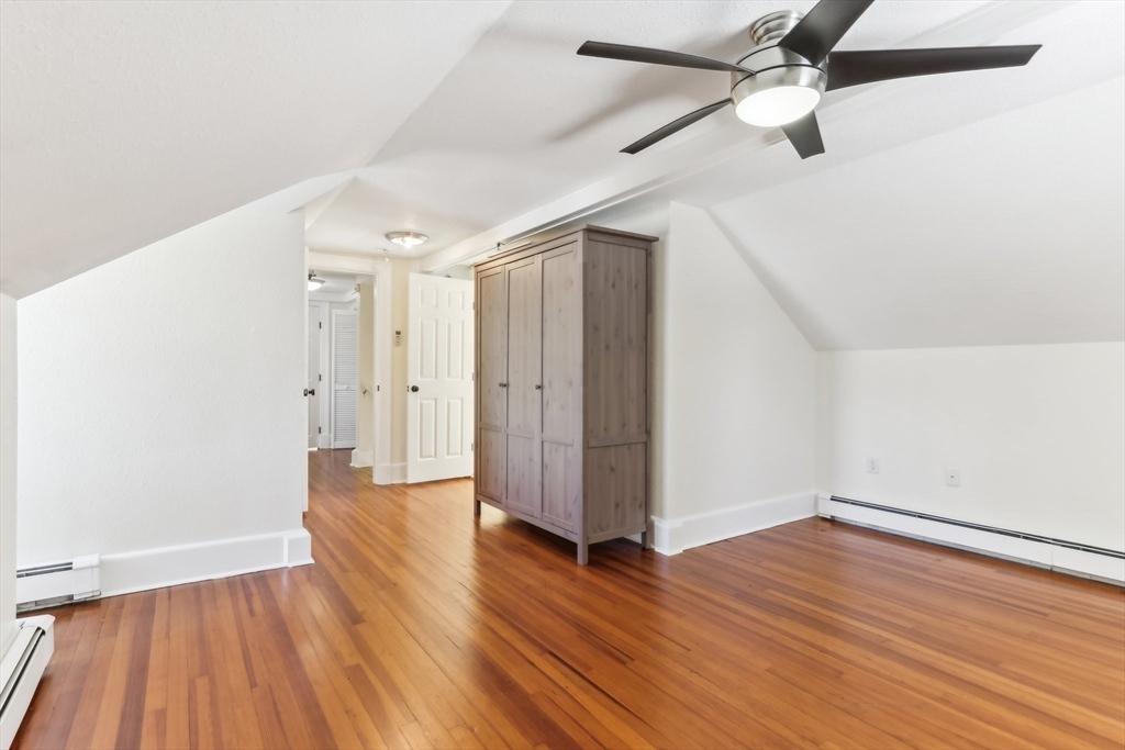27 Elm Road, Unit D Devens, MA 01434 - Photo 20 of 31 an empty room with wooden floor a ceiling fan and closet