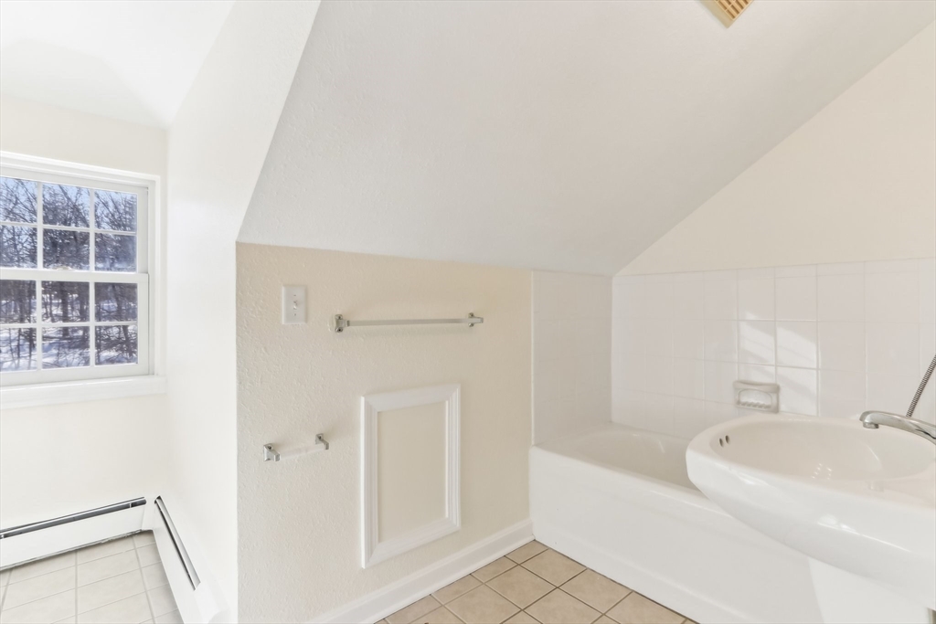 27 Elm Road, Unit D Devens, MA 01434 - Photo 21 of 31 a white bath tub sitting next to a white sink