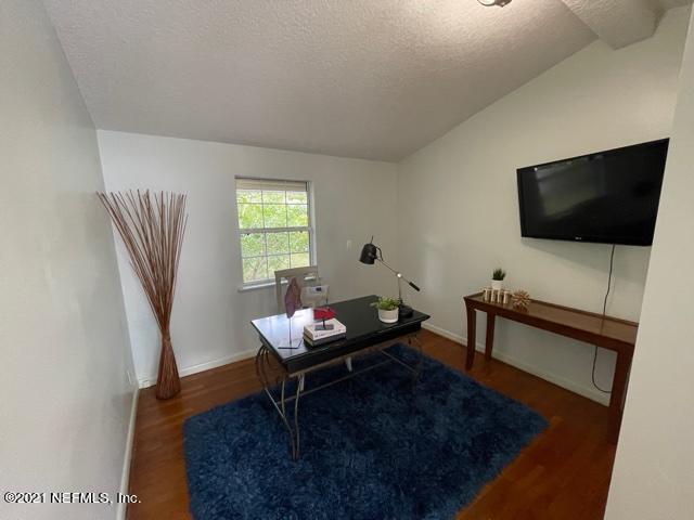 7124 St Augustine Road Jacksonville, FL 32217 - Photo 13 of 20 a living room with furniture and a flat screen tv