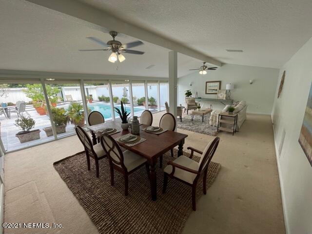 7124 St Augustine Road Jacksonville, FL 32217 - Photo 2 of 20 a view of a dining room with furniture window and outside view