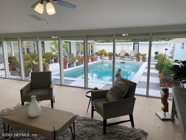 7124 St Augustine Road Jacksonville, FL 32217 - Photo 3 of 20 a living room with furniture and a potted plant