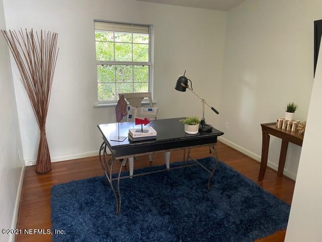 7124 St Augustine Road Jacksonville, FL 32217 - Photo 4 of 20 a living room with furniture and a window