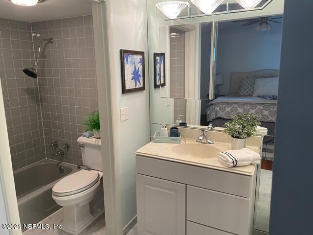 7124 St Augustine Road Jacksonville, FL 32217 - Photo 5 of 20 a bathroom with a sink a toilet and shower