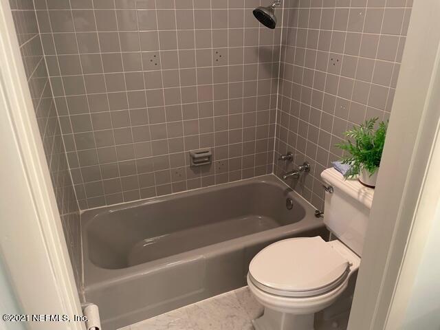 7124 St Augustine Road Jacksonville, FL 32217 - Photo 6 of 20 a bathroom with a toilet and a bathtub