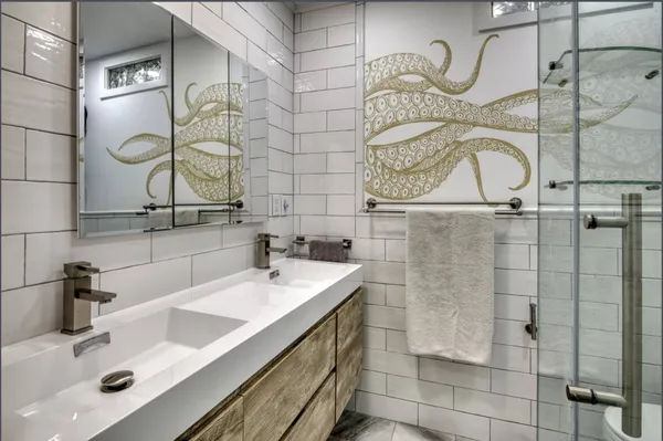 a bathroom with a sink and a mirror