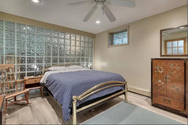 a bedroom with a bed and window