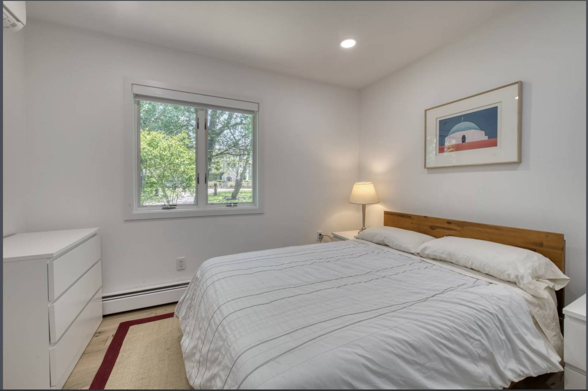 Undisclosed Address Montauk, NY 11954 - Photo 8 of 10 a bedroom with a bed and a window