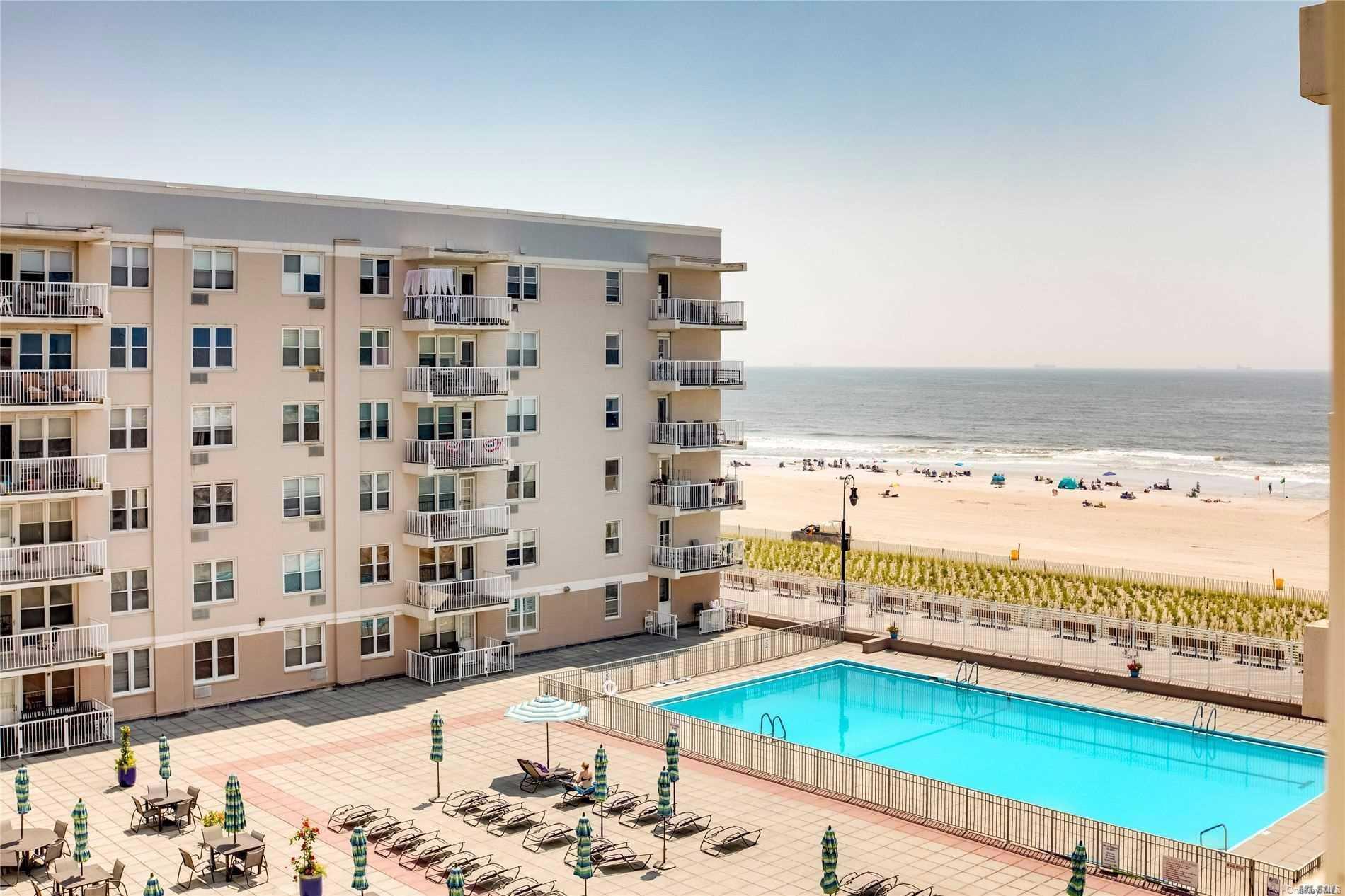 a view of a living room and a dining table