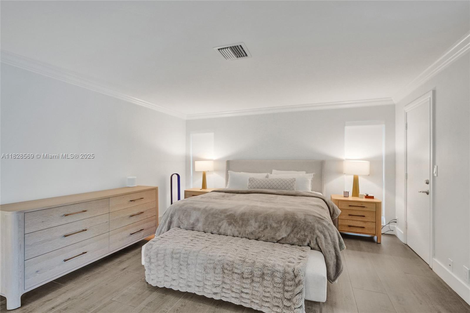 5854 Pinebrook Drive Boca Raton, FL 33433 - Photo 24 of 76 a bedroom with a bed and lamp