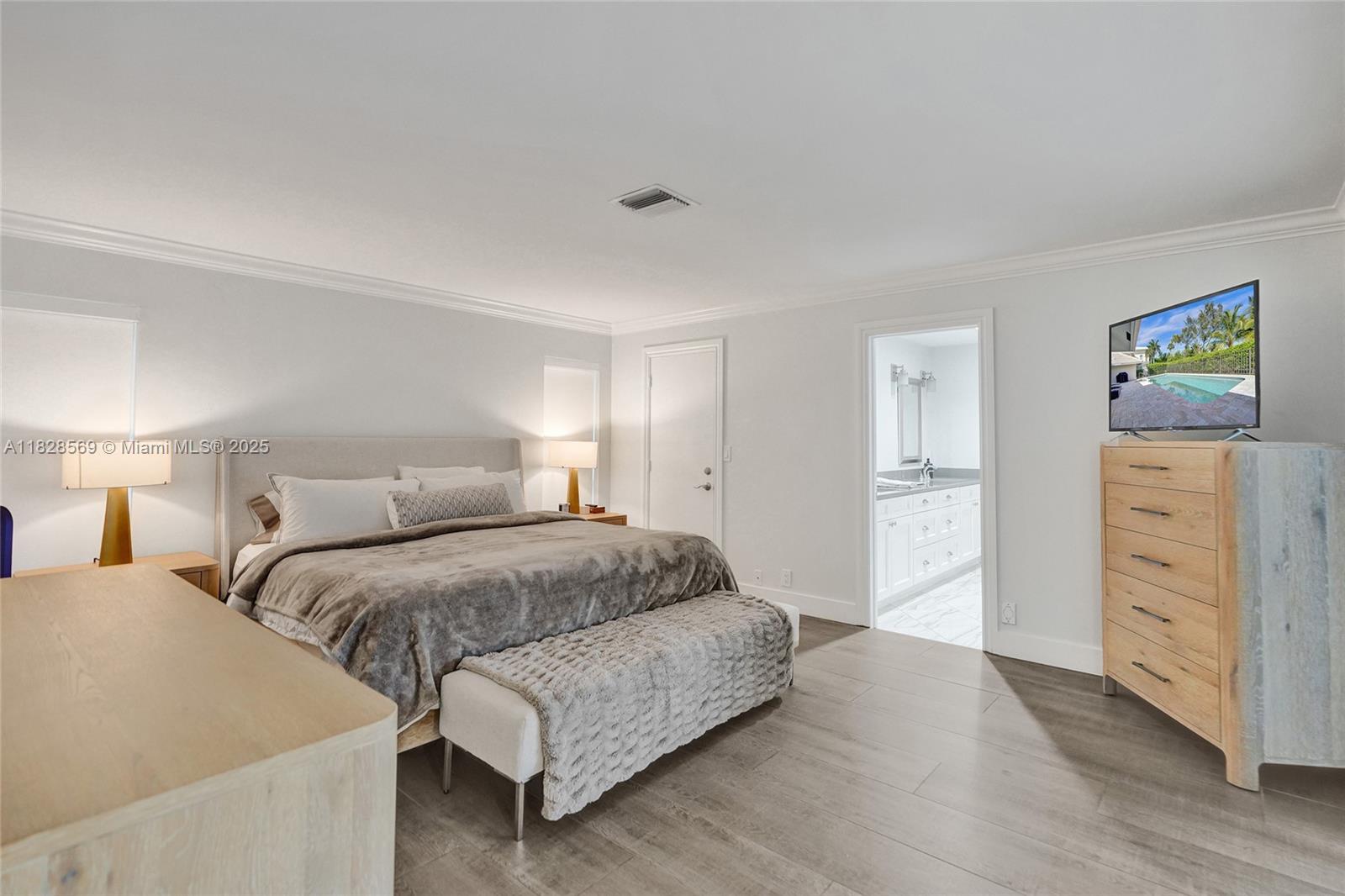 5854 Pinebrook Drive Boca Raton, FL 33433 - Photo 26 of 76 a bedroom with a bed and a dresser