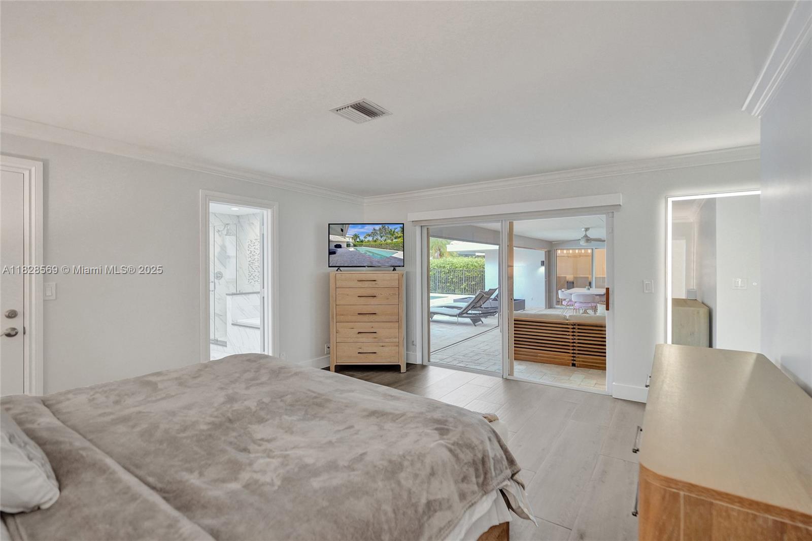 5854 Pinebrook Drive Boca Raton, FL 33433 - Photo 28 of 76 Primary Bedroom with sliding door to the pool area