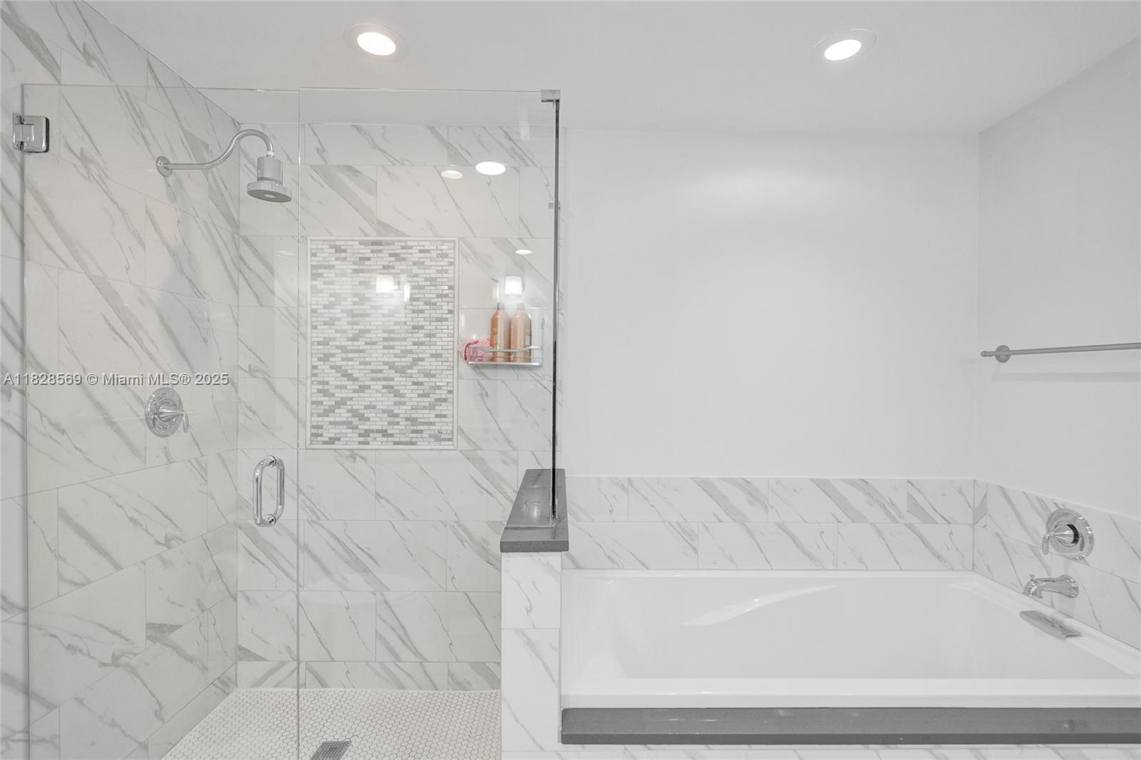 5854 Pinebrook Drive Boca Raton, FL 33433 - Photo 32 of 76 a bathroom with a bathtub and shower