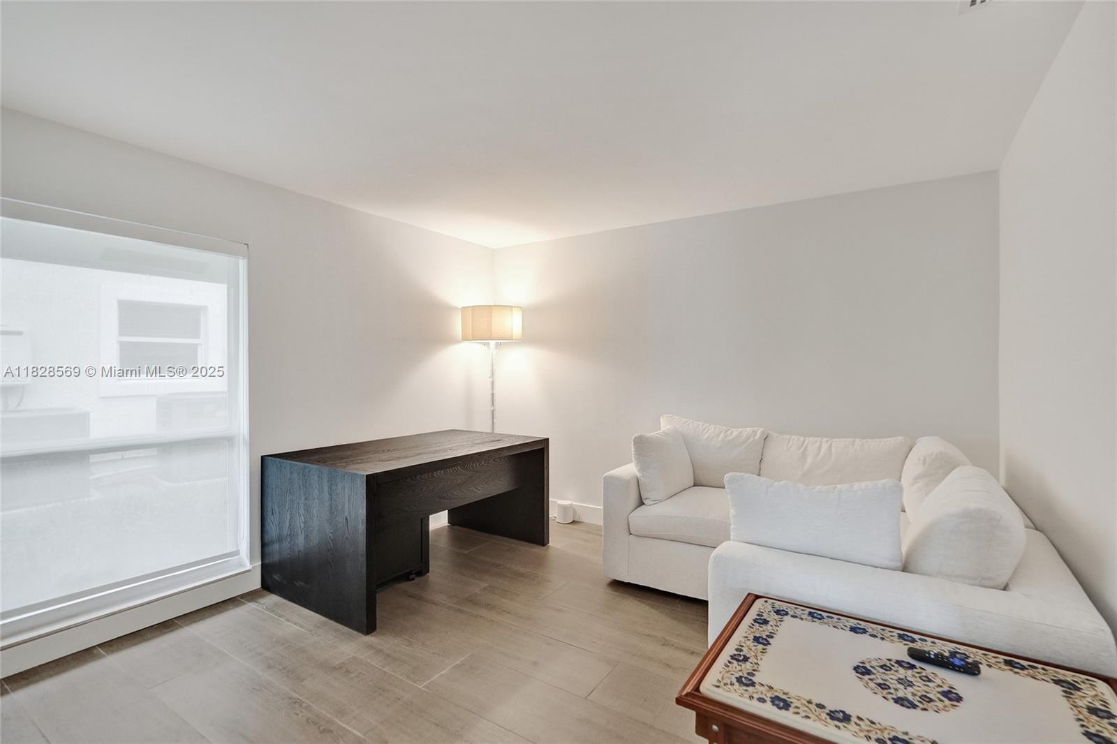 5854 Pinebrook Drive Boca Raton, FL 33433 - Photo 33 of 76 a living room with furniture and a window