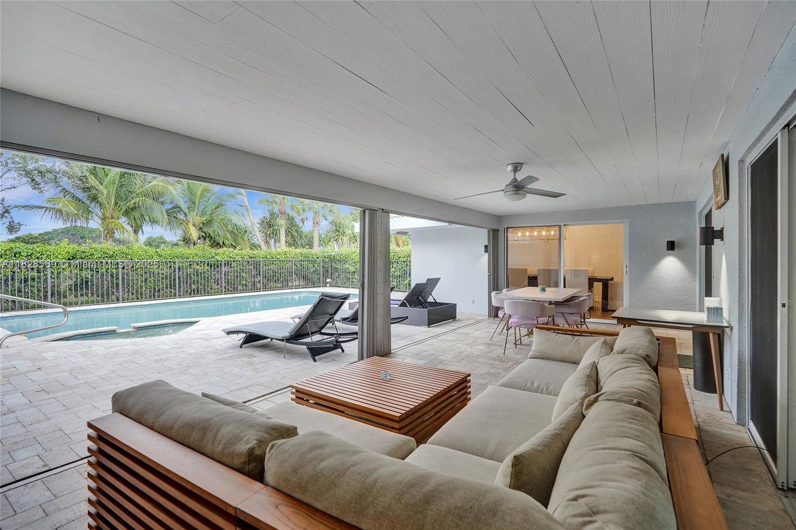 5854 Pinebrook Drive Boca Raton, FL 33433 - Photo 4 of 76 a living room with furniture and a large window