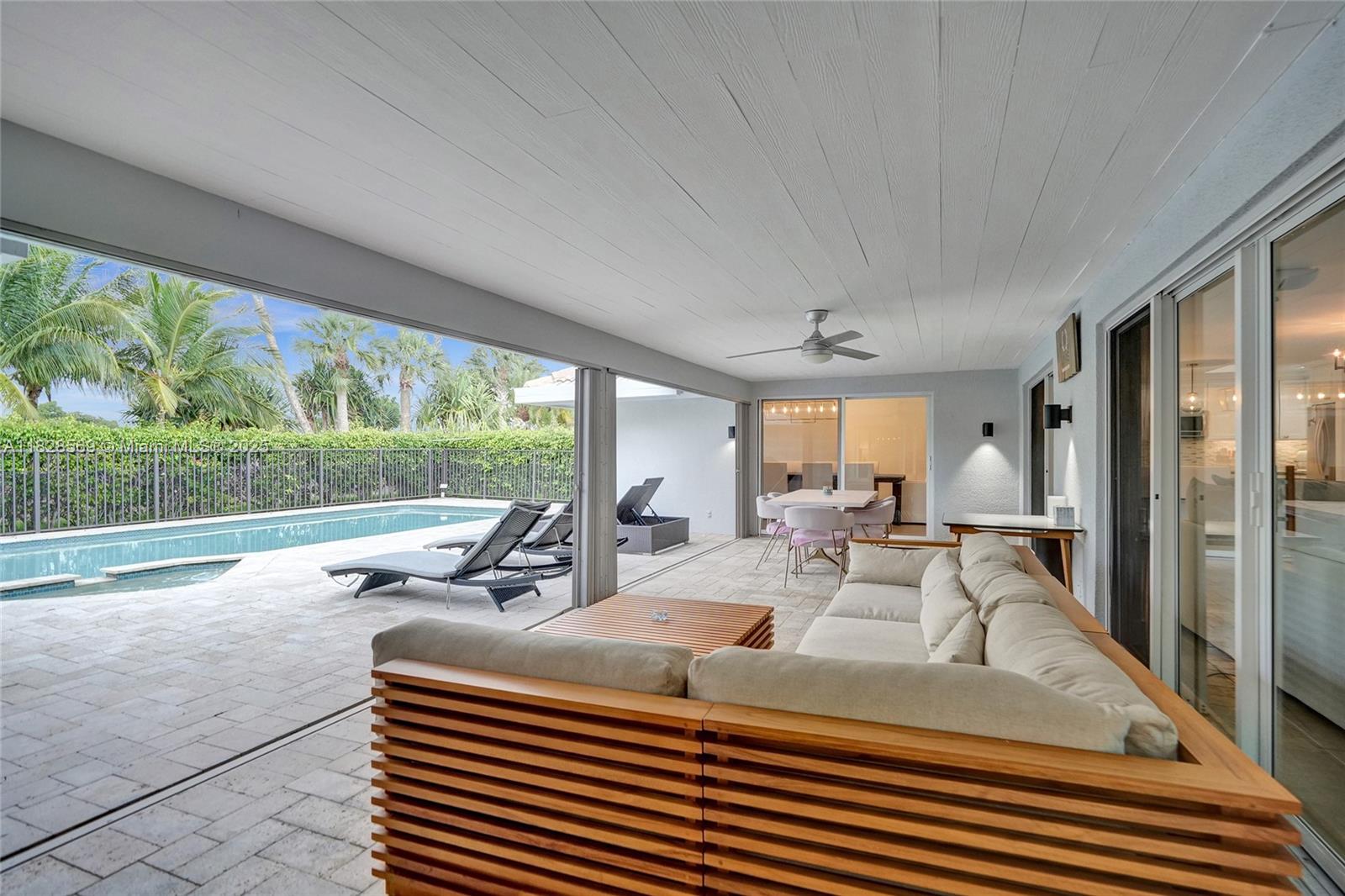5854 Pinebrook Drive Boca Raton, FL 33433 - Photo 44 of 76 a view of a dining room with furniture window and outside view