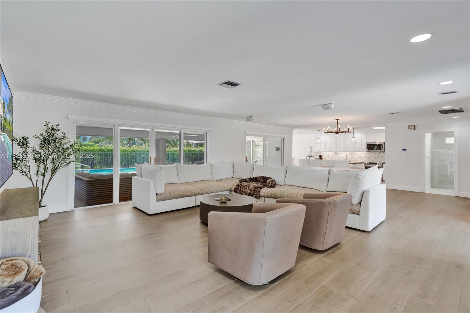 5854 Pinebrook Drive Boca Raton, FL 33433 - Photo 5 of 76 a living room with furniture and a large window