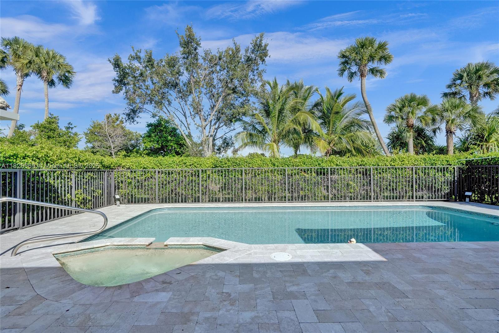 5854 Pinebrook Drive Boca Raton, FL 33433 - Photo 52 of 76 a view of a backyard with swimming pool and trees in the background
