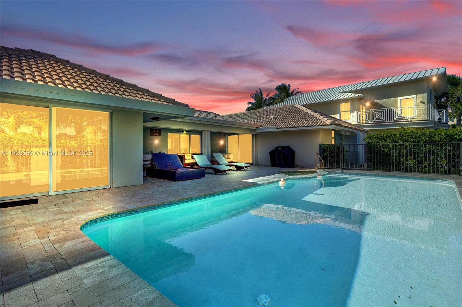 5854 Pinebrook Drive Boca Raton, FL 33433 - Photo 56 of 76 a front view of a house with a yard