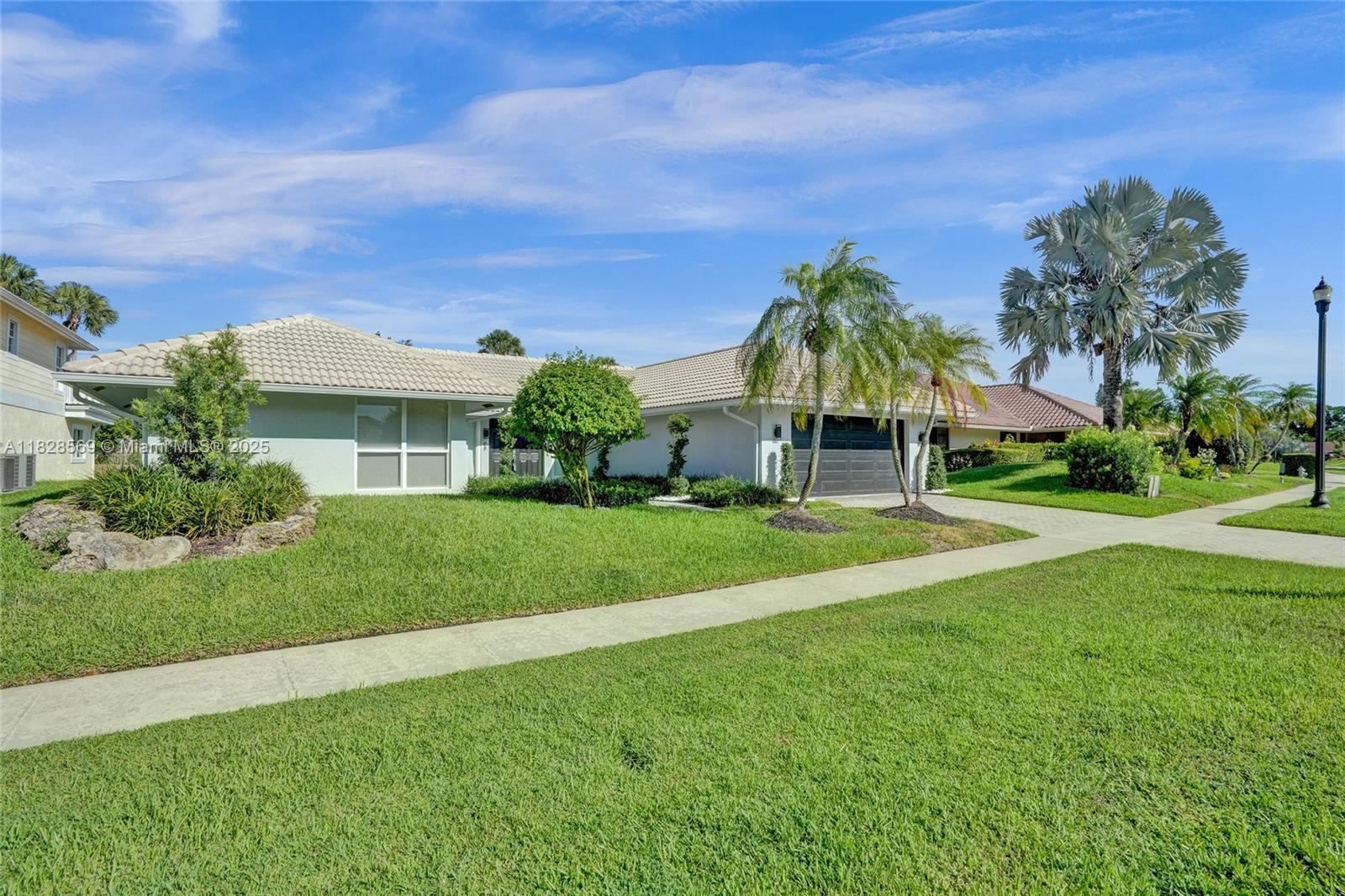 5854 Pinebrook Drive Boca Raton, FL 33433 - Photo 64 of 76 New installed landscaping, bushes, and grass.