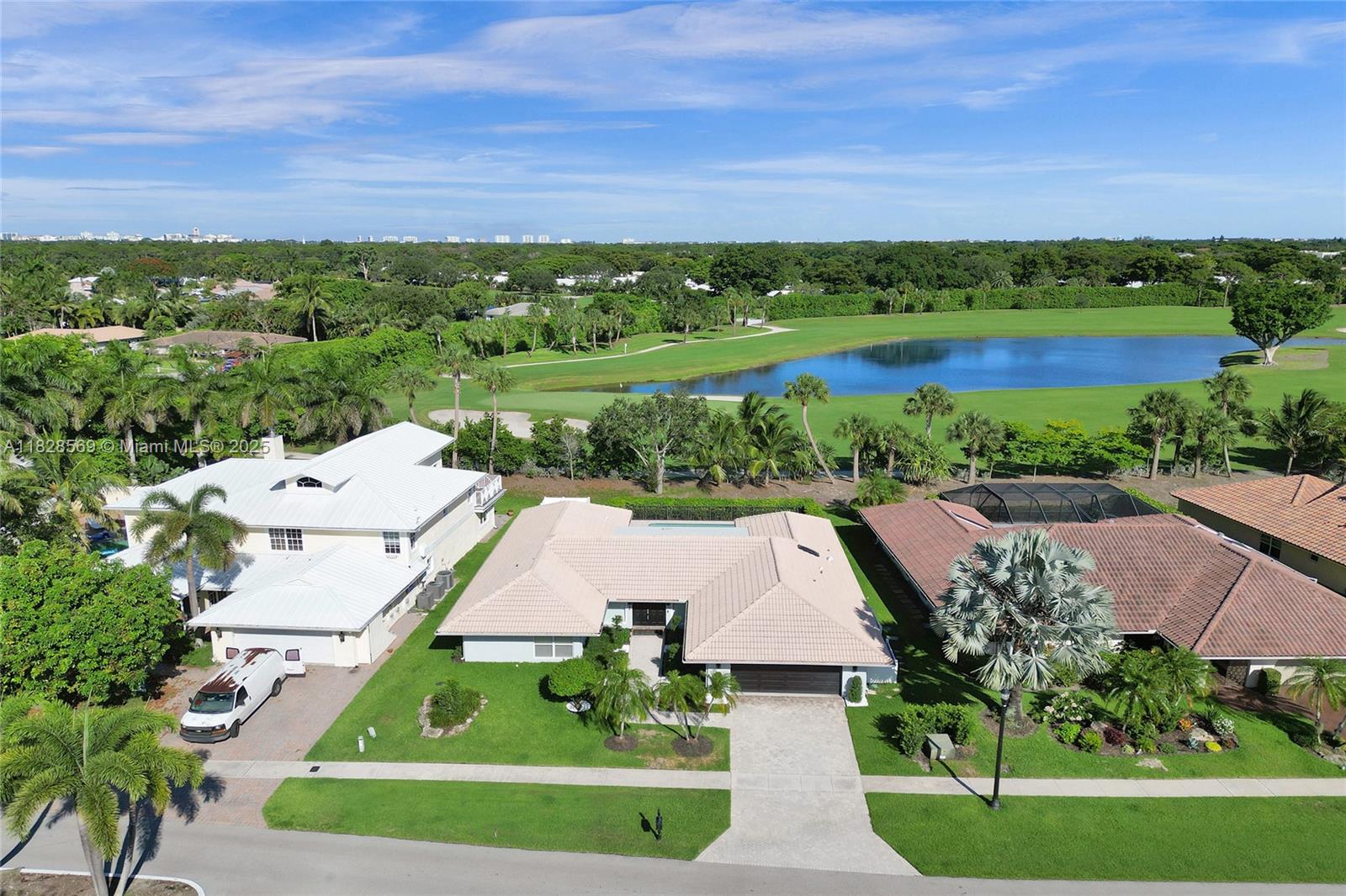 5854 Pinebrook Drive Boca Raton, FL 33433 - Photo 66 of 76 an aerial view of a house with a garden
