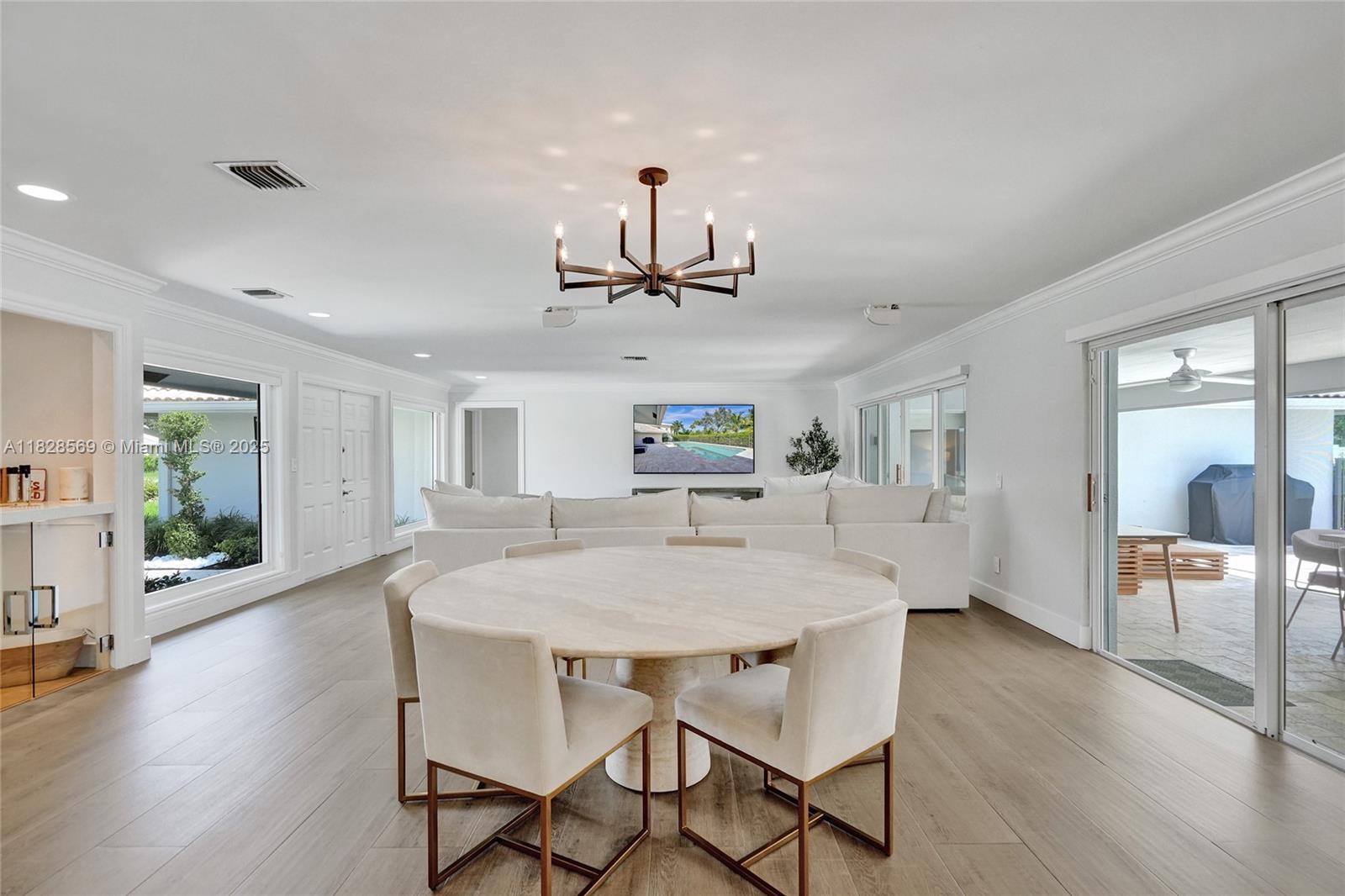 5854 Pinebrook Drive Boca Raton, FL 33433 - Photo 7 of 76 a view of a dining room with furniture window and wooden floor