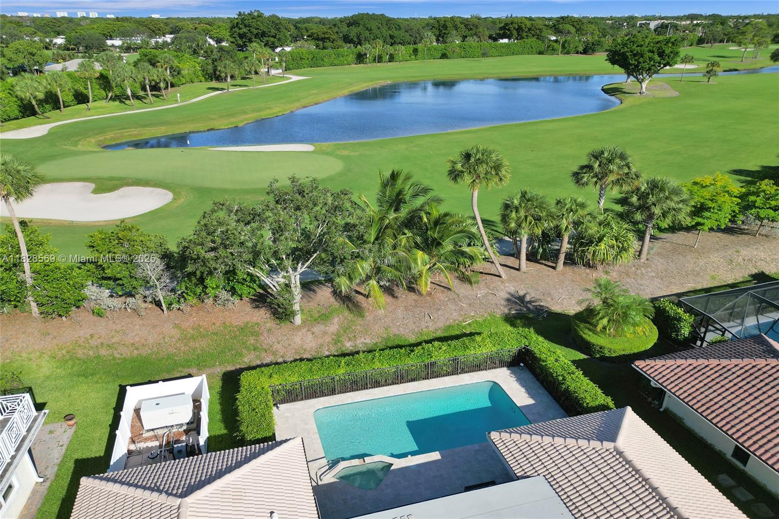 5854 Pinebrook Drive Boca Raton, FL 33433 - Photo 76 of 76 an aerial view of a house with a yard and lake view