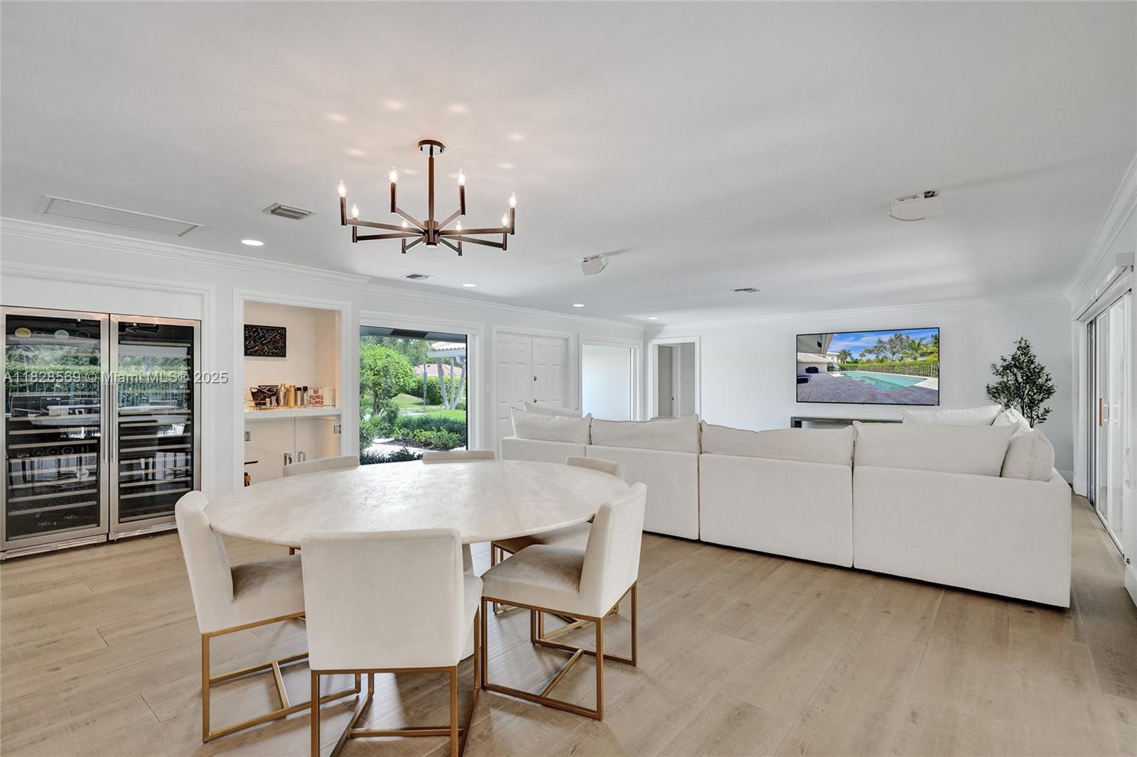 5854 Pinebrook Drive Boca Raton, FL 33433 - Photo 8 of 76 a living room with furniture and a large window