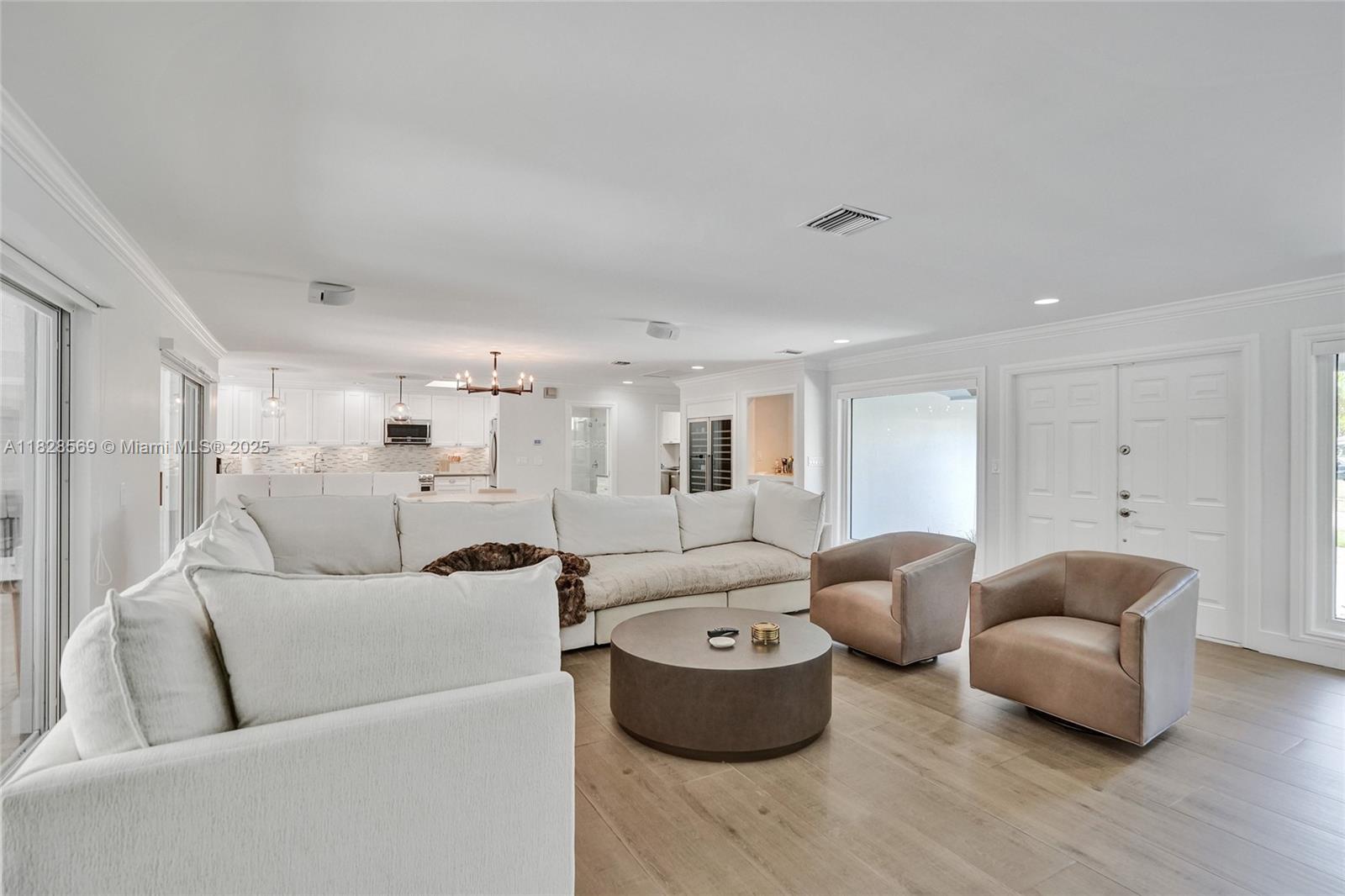 5854 Pinebrook Drive Boca Raton, FL 33433 - Photo 10 of 76 a living room with furniture and a large window